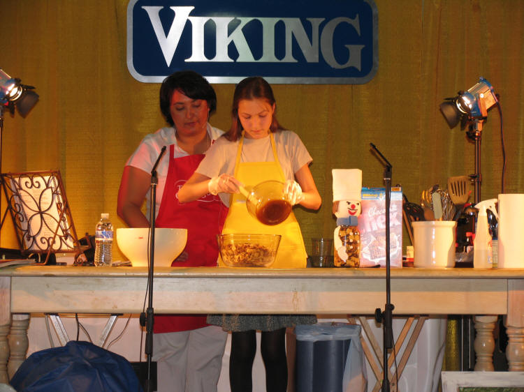 Mallory with Danielle Edmonds on stage at Taste of Home Cooking School in Kalispell, Montana