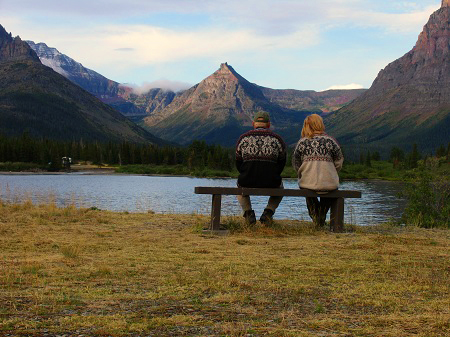 Couple sitting on bench in Two Medicine, Glacier National Park