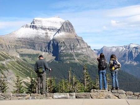 David and the girls look out over the parking lot at Logan Pass.