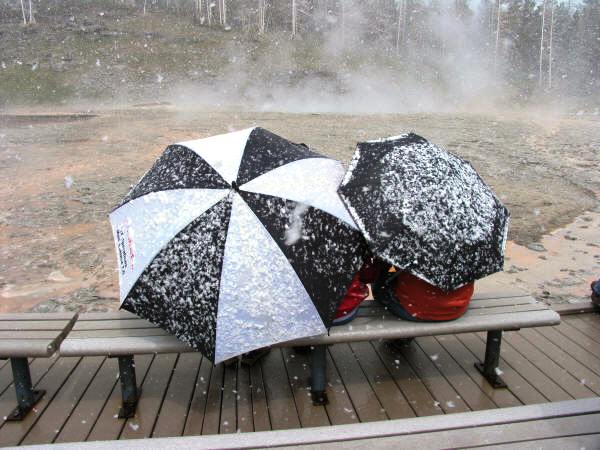 Tourists endure a snow shower waiting for geyser to erupt. - RMKK Companion